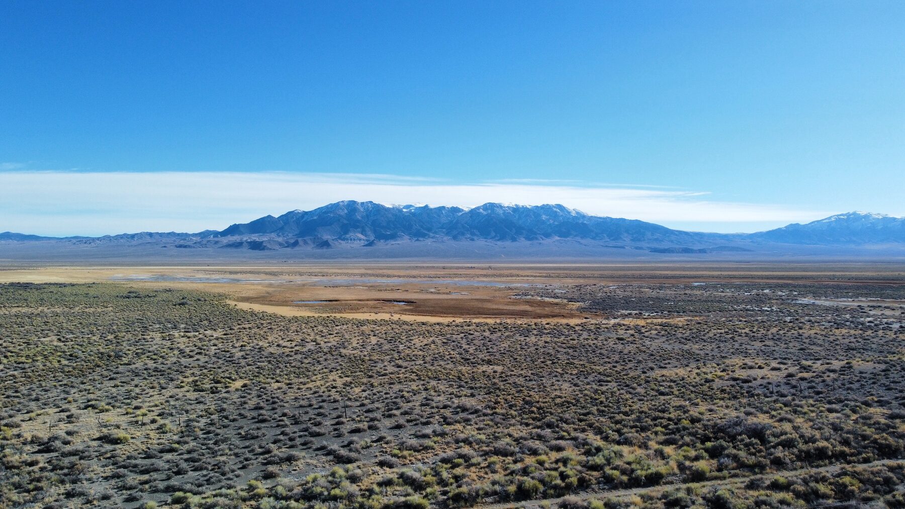 High desert valley and snow-dusted range in Nevada